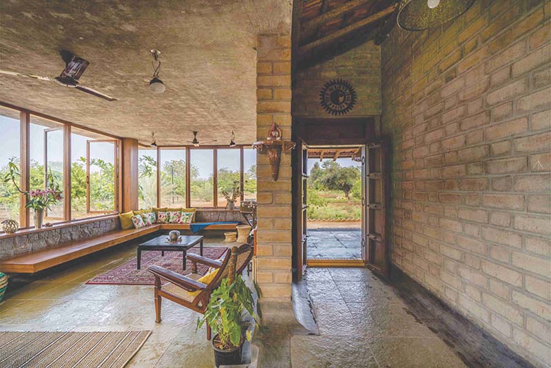 Earthy Farmhouse Design Weaved Around A Traditional Courtyard