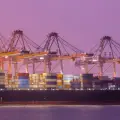 Import delays and port logjams disrupt supply chains, halting compressor production.