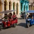 Chinese-made electric tricycles with solar charging are helping Cubans overcome fuel shortages and frequent blackouts.