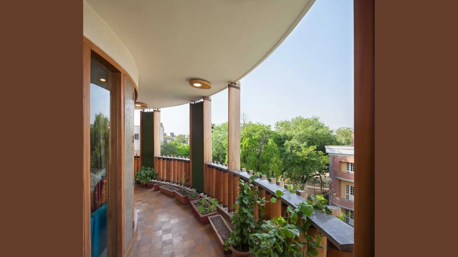 Outré House in New Delhi Reimagines Urban Living Through Craft, Curves and Nature