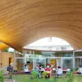 Toranoko Nursery in Japan Creates a Community Space Beneath a Sculptural Curved Roof
